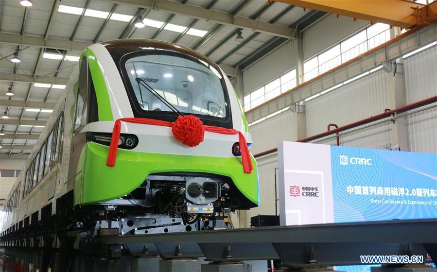 Photo taken on June 13, 2018 shows China\'s new generation domestic medium-low-speed magnetic levitation (maglev) train at the CRRC Zhuzhou Locomotive Co., Ltd., Zhuzhou of central China\'s Hunan Province. The new train rolled off the production line Wednesday and can run up to 160 km per hour, compared with the first generation\'s top speed of 100 km per hour. (Photo/Xinhua)