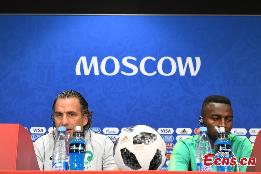 Saudi Arabia coach Juan Antonio Pizzi (L) and footballer Osama Hawsawi attend a press conference in Moscow, Russia, June 13, 2018, ahead of the World Cup. (Photo: China News Service/Tian Bochuan)