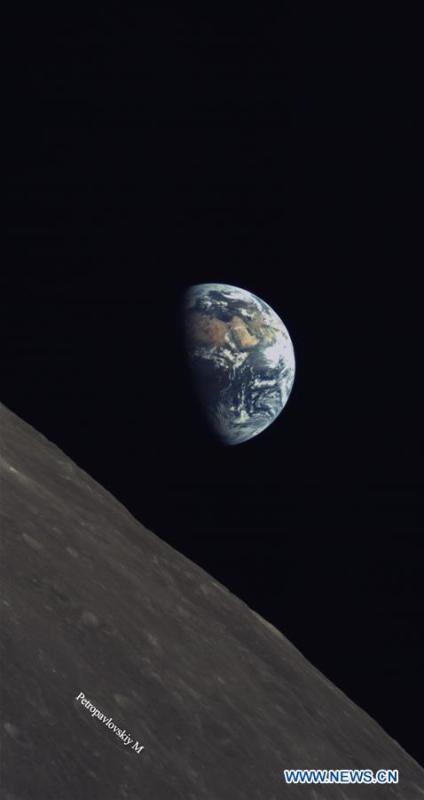 A released photo shows part of the moon with the earth as background. China and Saudi Arabia on June 14, 2018 jointly unveiled three lunar images acquired through cooperation on the relay satellite mission for Chang\'e-4 lunar probe. An optical camera, developed by the King Abdulaziz City for Science and Technology of Saudi Arabia, was installed on a micro satellite, named Longjiang-2. The micro satellite is orbiting around the Moon. The camera, which began to work on May 28, has conducted observations of the Moon and acquired a series of clear lunar images and data. (Xinhua)