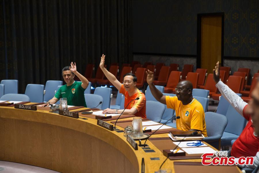 Ma Chaoxu (2nd, Left), China\'s permanent representative to the United Nations, attends an event to commemorate the inauguration of the World Cup, at the United Nations headquarters in New York City, New York, U.S, June 14, 2018. (Photo: China News Service/Liao Pan)