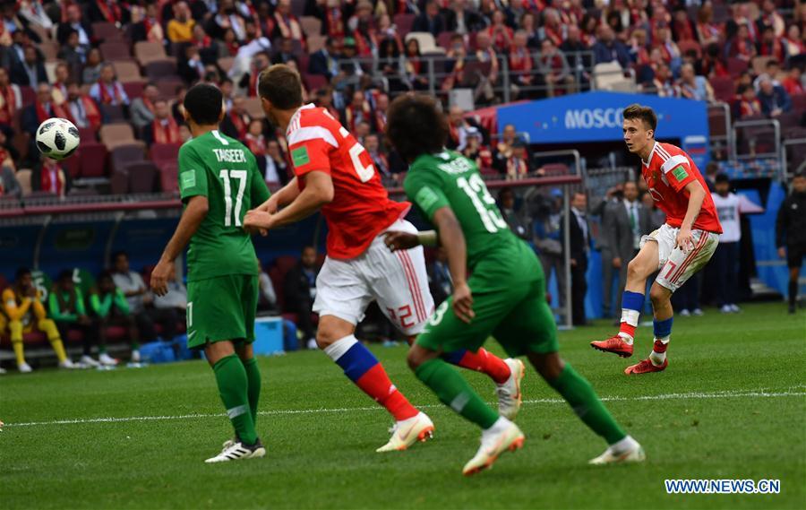 Russia\'s Aleksandr Golovin (1st R) scores a goal from a free kick against Saudi Arabia during the opening match of the 2018 FIFA World Cup in Moscow, Russia, on June 14, 2018. Russia won 5-0. (Xinhua/Chen Cheng)