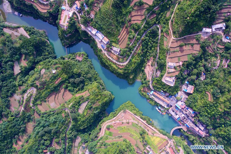 Aerial photo taken on June 12, 2018 shows Shenlongwan Village in Changzhi City, north China\'s Shanxi Province. A 1,526-meter-long road was built along the cliffs to connect isolated Shenlongwan to the outside. The construction of this miraculous road lasted for fifteen years from 1985 to 2000, and was built purely by villagers of Shenlongwan. Thanks to this road, villagers here now cast off poverty by developing tourism. (Xinhua/Cao Yang)