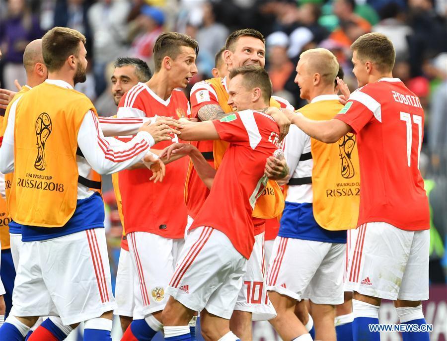 Russia\'s players celebrate their victory against Saudi Arabia during the opening match of the 2018 FIFA World Cup in Moscow, Russia, on June 14, 2018. Russia won 5-0. (Xinhua/Liu Dawei)