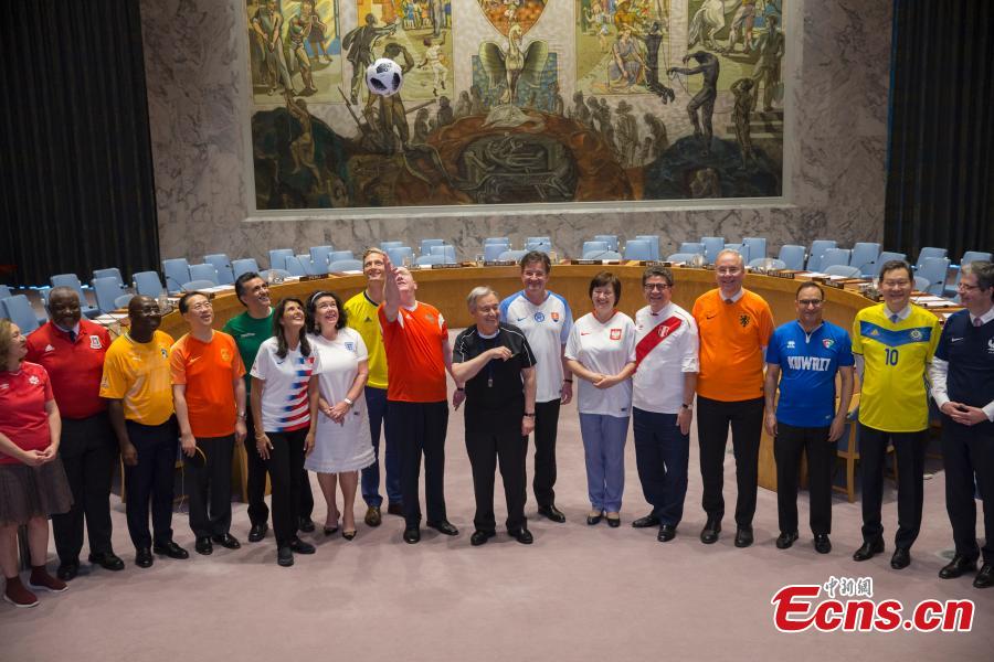 Members of the United Nations Security Council pose for a picture while wearing soccer jerseys to commemorate the inauguration of the World Cup, at the United Nations headquarters in New York City, New York, U.S, June 14, 2018. (Photo: China News Service/Liao Pan)