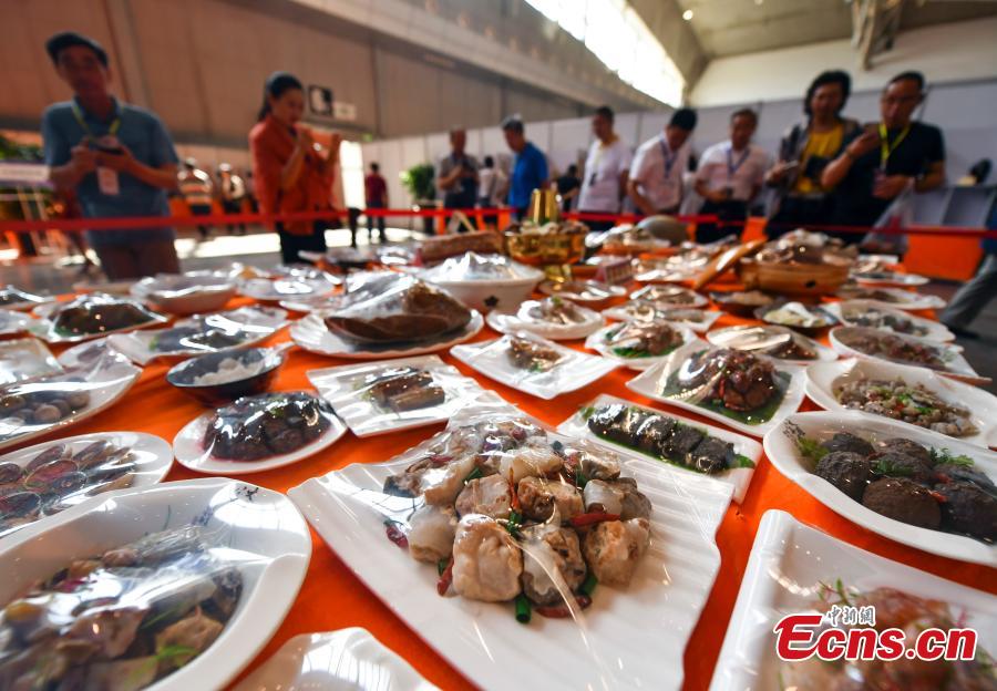 A stone banquet made of rare stones is on display at an exhibition center in Urumqi, capital of northwest China\'s Xinjiang Uygur Autonomous Region, June 15, 2018. (Photo: China News Service/Liu Xin)