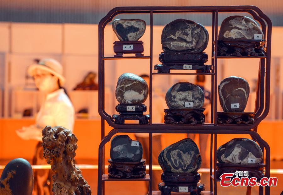 Rare stones are on display at an exhibition center in Urumqi, capital of northwest China\'s Xinjiang Uygur Autonomous Region, June 15, 2018. (Photo: China News Service/Liu Xin)