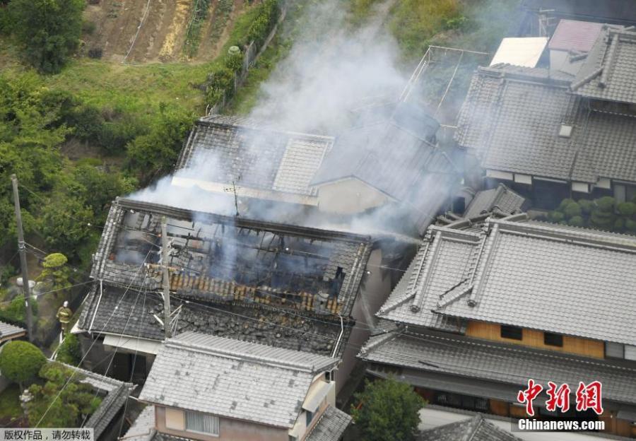 Smoke rises from a house where a fire breaks out, in Takatsuki, Osaka prefecture, western Japan, in this photo taken by Kyodo, June 18, 2018. (Photo/China News Service)