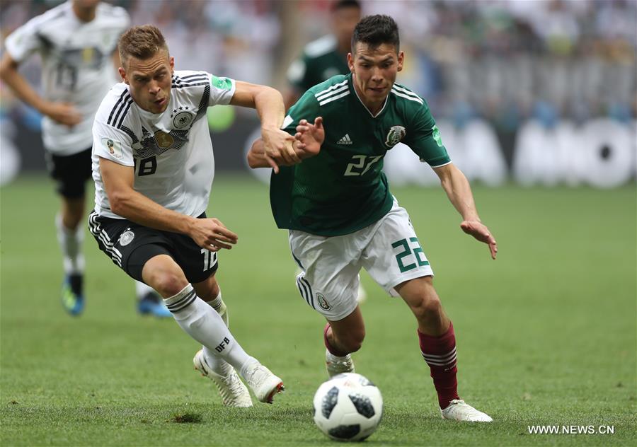 Joshua Kimmich (L) of Germany vies with Hirving Lozano of Mexico during a group F match between Germany and Mexico at the 2018 FIFA World Cup in Moscow, Russia, June 17, 2018. (Xinhua/Xu Zijian)