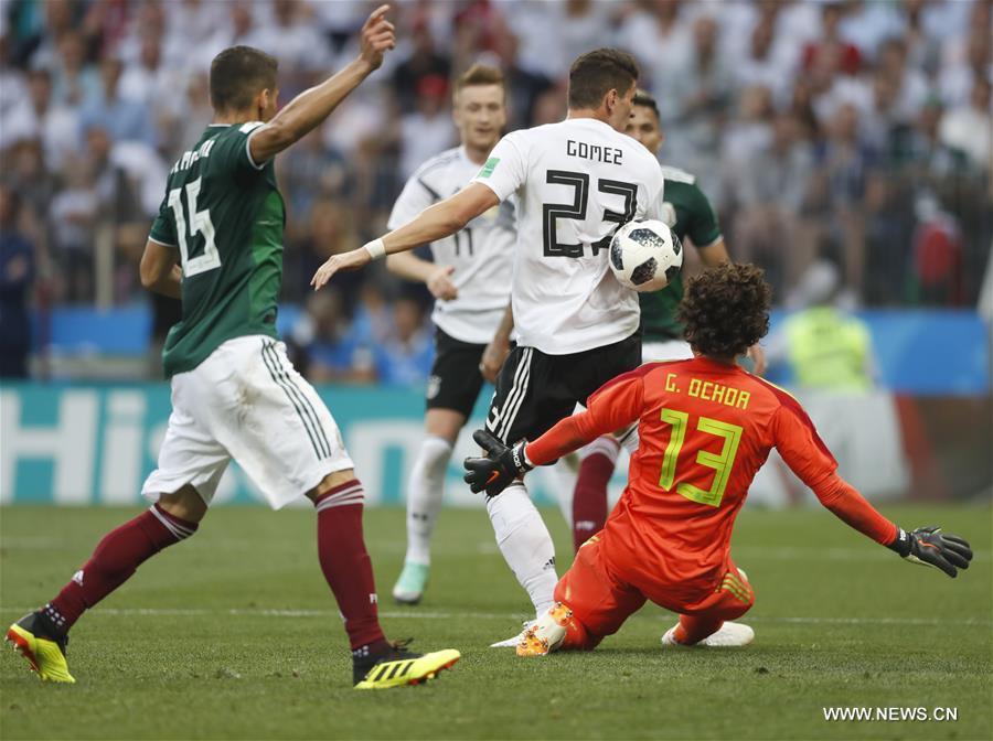 Mario Gomez (2nd R) of Germany vies with Guillermo Ochoa (1st R) of Mexico during a group F match between Germany and Mexico at the 2018 FIFA World Cup in Moscow, Russia, June 17, 2018. Mexico won 1-0. (Xinhua/Cao Can)