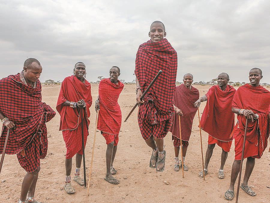 Masai men sing and welcome visitors to a village in the Amboseli National Park. (PHOTO BY XIE SONGXIN/CHINA DAILY)

Arrival

Once at Nairobi airport, the road trip of 16 kilometers will lead tourists to the city center, offering glimpses of life in the countryside as well as the urban hustle and bustle.

After checking into a hotel, one can choose from a host of tour options such as viewing giraffes or visiting an elephant orphanage located near Nairobi National Park and managed by Daphne Sheldrick, the widow of the well-known game warden David Sheldrick.

An entry ticket to the haven for elephants rescued from parks and reserves is 35 yuan ($5) per person.

Eating authentic Kenyan food for dinner while being entertained by traditional dancers might be a relaxing way to end the first day.

The Nairobi Gallery - in the heart of the city and housed in an old government building - is available for those with a taste for art. Locals used to refer to the building, constructed in 1913, as the place for \