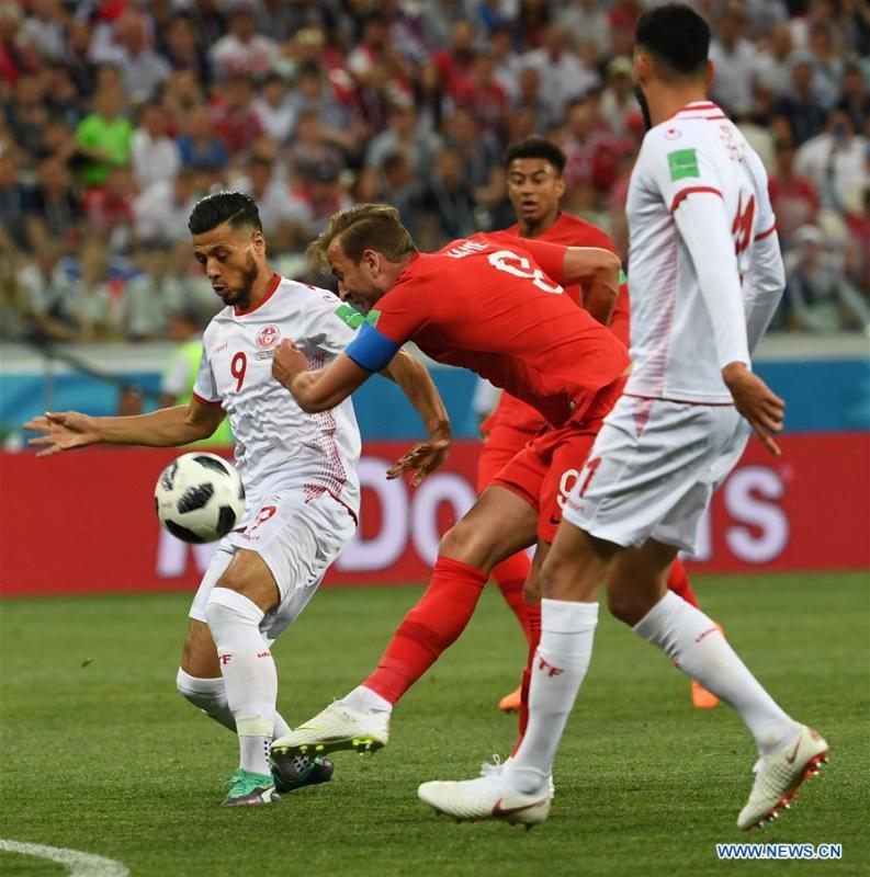 Harry Kane (C) of England shoots to score during a group G match between Tunisia and England at the 2018 FIFA World Cup in Volgograd, Russia, June 18, 2018. (Xinhua/Chen Cheng)