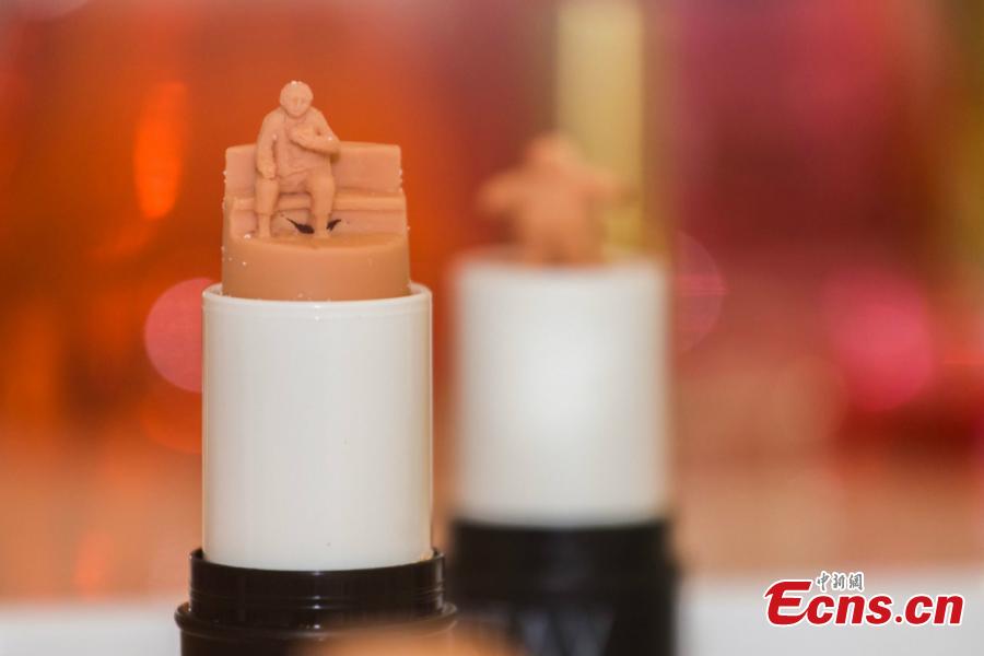 Makeup artist May Sum of Hong Kong displays a collection of her amazing sculptures made out of lipstick at an exhibition in Southwest China’s Chongqing Municipality, June 19, 2018. The artist said she wanted to explore the possibilities in art creation through meticulously hand-sculpted works. (Photo: China News Service/Zhong Xin)