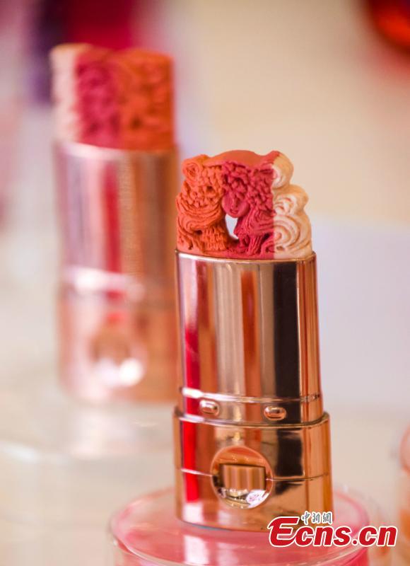 Makeup artist May Sum of Hong Kong displays a collection of her amazing sculptures made out of lipstick at an exhibition in Southwest China’s Chongqing Municipality, June 19, 2018. The artist said she wanted to explore the possibilities in art creation through meticulously hand-sculpted works. (Photo: China News Service/Zhong Xin)