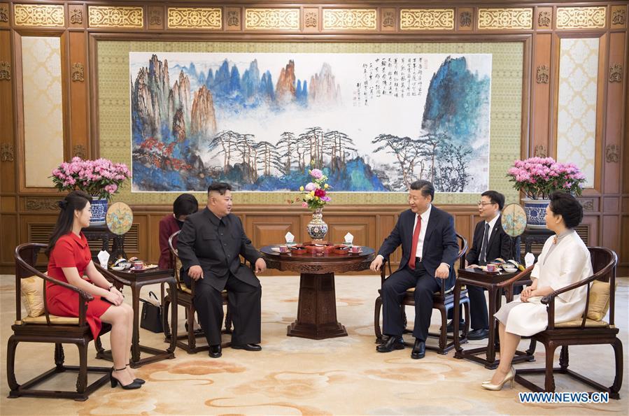 Xi Jinping (3rd R), general secretary of the Central Committee of the Communist Party of China (CPC) and Chinese president, meets with Kim Jong Un (3rd L), chairman of the Workers\' Party of Korea (WPK) and chairman of the State Affairs Commission of the Democratic People\'s Republic of Korea (DPRK), at the Diaoyutai State Guesthouse in Beijing, capital of China, June 20, 2018. Xi\'s wife Peng Liyuan (1st R) and Kim\'s wife Ri Sol Ju (1st L) also attended the meeting. (Xinhua/Li Xueren)