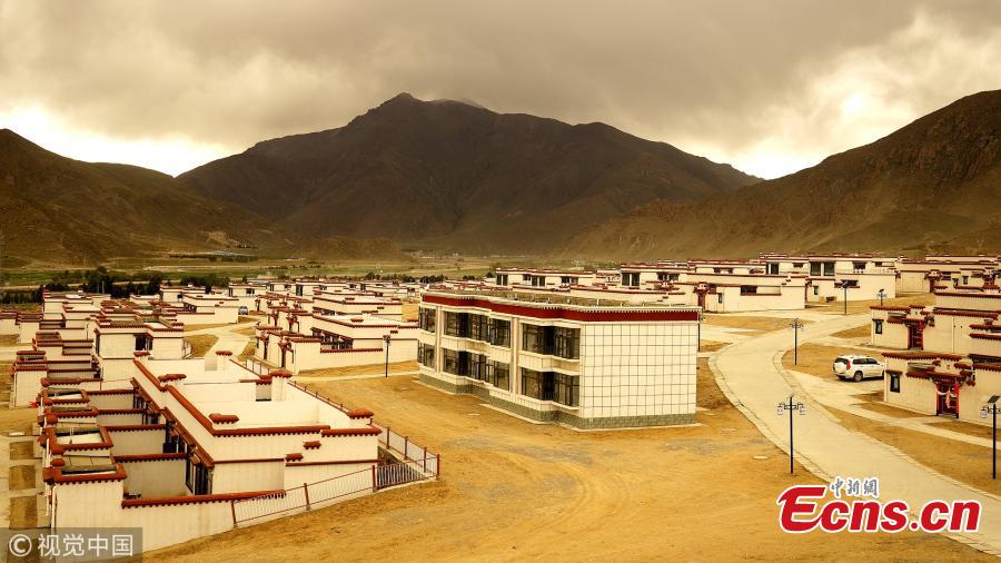 A view of newly built homes for relocated residents in Doilungdeqen District, Lhasa City, Southwest China’s Tibet Autonomous Region, June 20, 2018. Residents who once lived in Rongma Township of Nyima County, which averages 5,000 meters above sea level and faces difficulties in poverty alleviation, have been relocated to new homes at an altitude of 3,800 meters. The ecological relocation stretching more than 1,000 kilometers can also help conserve wild animals on the Northern Tibet Plateau. (Photo/VCG)
