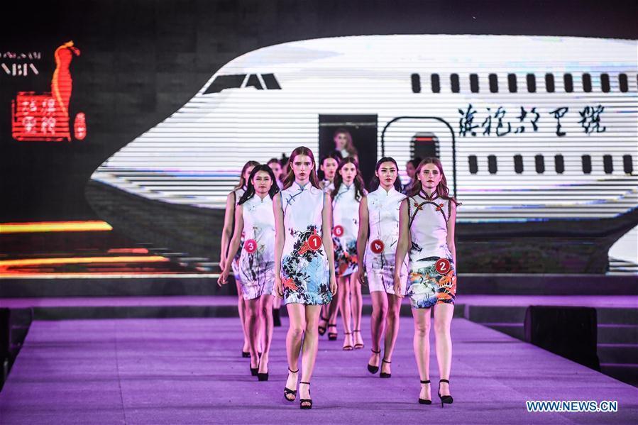 Models show cheongsam, traditional Chinese women\'s dress also known as Qipao, during the 1st international qipao model competition in Xinbin Manchu Autonomous County in Fushun City, northeast China\'s Liaoning Province, June 23, 2018. (Xinhua/Pan Yulong)