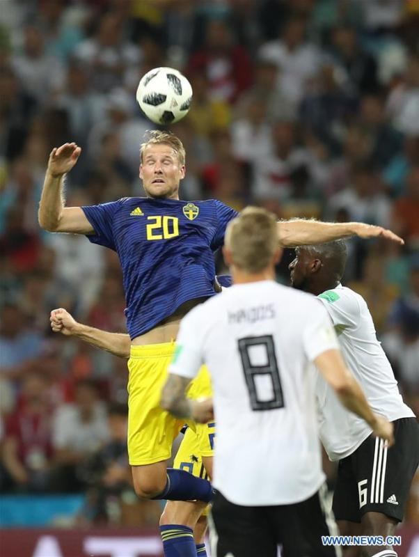 Ola Toivonen (top) of Sweden competes for a header during the 2018 FIFA World Cup Group F match between Germany and Sweden in Sochi, Russia, June 23, 2018. (Xinhua/Lu Jinbo)