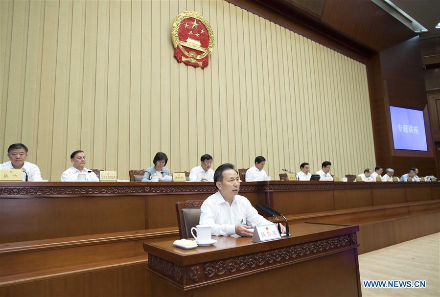 Minister of Ecology and Environment Li Ganjie (front) holds a lecture on the goal of building a Beautiful China after the conclusion of a bimonthly session of the 13th National People\'s Congress (NPC) Standing Committee at the Great Hall of the People in Beijing, capital of China, June 22, 2018. Li Zhanshu, chairman of the NPC Standing Committee, presided over the bimonthly session\'s closing meeting. (Xinhua/Li Tao)