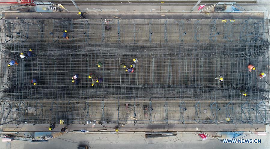 In this aerial photo taken on June 23, 2018, workers make prefabricated building parts for the Gansu-Ningxia section of the Yinchuan-Xi\'an high-speed railway in northwest China\'s Ningxia Hui Autonomous Region. The 617-kilometer high-speed railway is scheduled to start operation by the end of 2020 with a design speed of 250 kilometers per hour. (Xinhua/Wang Peng)