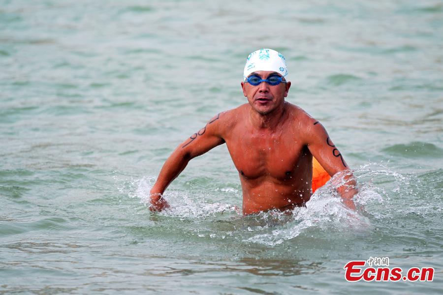A participant competes in a swimming race across the Yellow River in Xunhua Salar Autonomous County, Northwest China’s Qinghai Province, June 24, 2018. The race on China’s second longest river was 500 meters long. (Photo: China News Service/Zhang Tianfu)