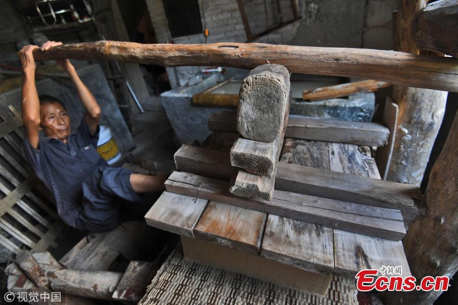 Huang Shiguo, 65, makes paper using ancient methods in his home in Baishui Village, Qiandongnan Miao and Dong Autonomous Prefecture, Southwest China’s Guizhou Province. Huang said he began learning the traditional paper-making craft at 29 and has been dedicated to the ancient craft ever since. Locals in the area have a more than 1,000-year history of paper making as the region is rich in Yangshan Bamboo, a main material needed for the craft. Huang said the typical process involves 72 steps and 55 days to produce paper. (Photo/VCG)