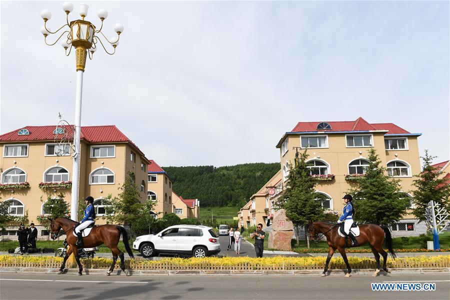 Members of a female mounted patrol unit are seen on duty in Arxan, north China\'s Inner Mongolia Autonomous Region, June 24, 2018. Every year, the female mounted patrol unit of Arxan will patrol the city between June and October, the high season for tourism. Apart from regular patrols, the members are also expected to perform ceremonial tasks on formal occasions. (Xinhua/Liu Lei)