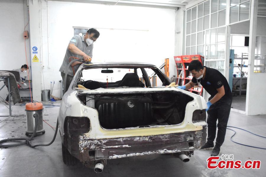A classic car is repaired at Dalian Jingdian Auto Culture Center in Dalian City, Liaoning Province, June 26, 2018. The center has hundreds of classic cars under maintenance, including a car donated by Stalin to Mao Zedong and a 1932 Rolls-Royce 20/25 car. Center founder Han Yeguang said all the classic cars were either from foreign museums or private collectors, and the time taken to restore each vehicle ranged from six months to four years. (Photo: China News Service/Yang Yi)