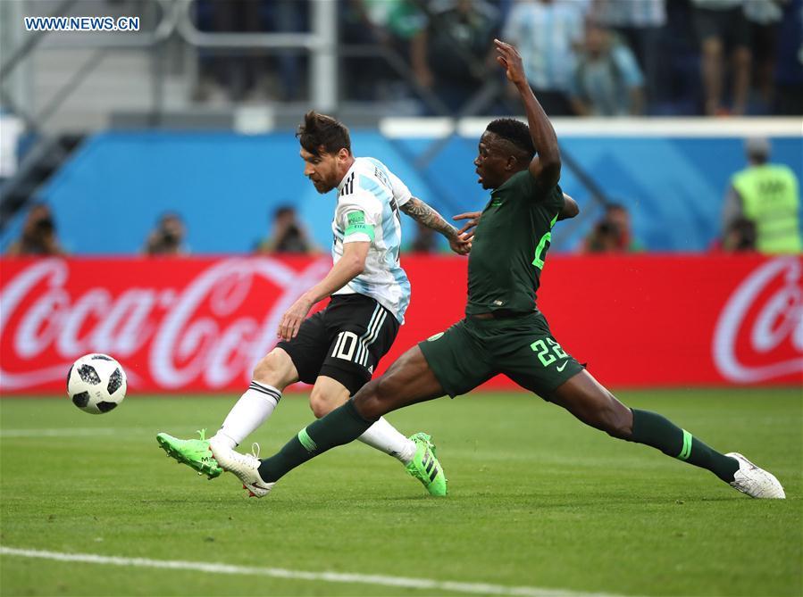 Lionel Messi (L) of Argentina shoots to score during the 2018 FIFA World Cup Group D match between Nigeria and Argentina in Saint Petersburg, Russia, June 26, 2018. (Xinhua/Wu Zhuang)