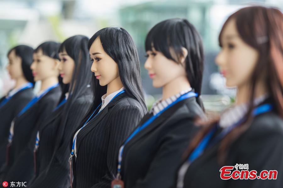 Humanoid robots are used to promote public awareness of drug abuse in an event to mark the International Day Against Drug Abuse and Illicit Trafficking at a railway station in Shenzhen City, South China\'s Guangdong Province, June 26, 2018. The six robots distributed brochures and interacted with visitors at the event, jointly organized by local police, an artificial intelligence association and a robot developer. (Photo/IC)
