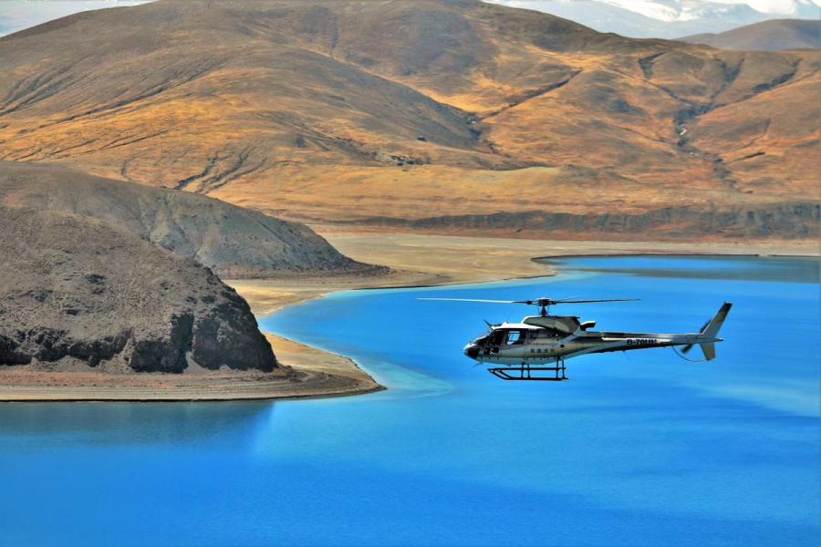 A helicopter flies over the Nam Co Lake, Tibet autonomous region. (Photo provided to chinadaily.com.cn)

Tibet has a fascinating landscape, but visitors cannot easily reach there because of long distance between scenic spots and other spots, as well as high mountains. Therefore, visitors needed to drive for a long time.

But now, they can fly on helicopters to enjoy the beautiful scenery.

As the only helicopter business operator in Tibet, Lhasa Xueying General Aviation Co Ltd has three routes including over Lhasa, a chartered flight from Lhasa to Nam Co Lake, and another chartered flight from Lhasa to Yamdroktso Lake.

By taking helicopter, visitors can save three or four hours from Lhasa to Nam Co Lake.