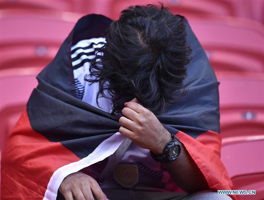 A fan of Germany reacts after the 2018 FIFA World Cup Group F match between Germany and South Korea in Kazan, Russia, June 27, 2018. South Korea won 2-0. (Xinhua/Chen Yichen)
