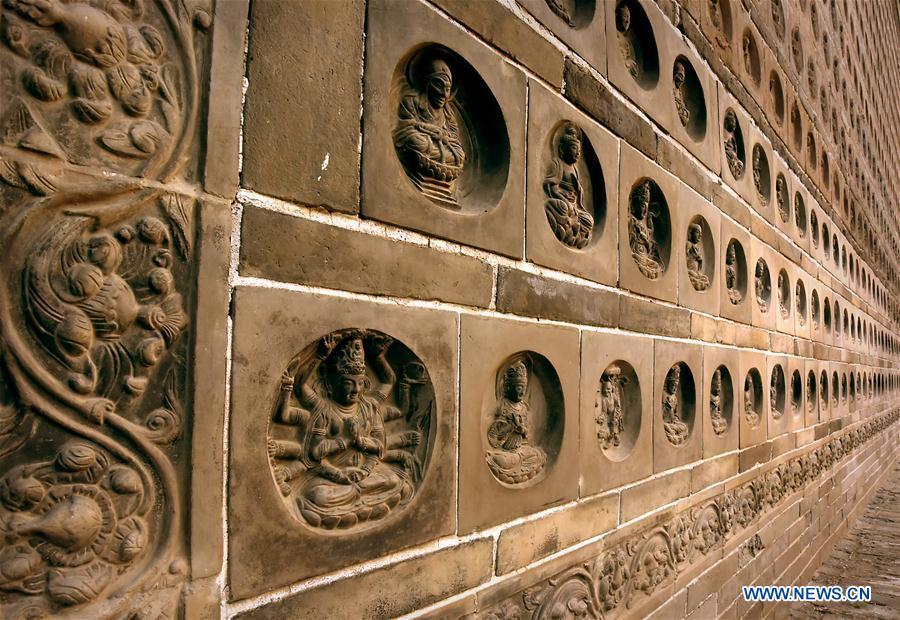 File photo taken on Oct. 17, 2015 shows brick carving on the Fanta Pagoda in Kaifeng, central China\'s Henan Province. The pagoda was built in 974 A.D. Pagodas built in ancient times in Henan act not only as landmarks for sight-seeing, but also as observers of the Chinese history. (Xinhua/Li An)