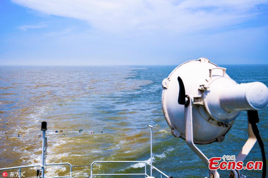 Muddy and clear waters converge in the Yellow River estuary in Dongying City, East China’s Shandong Province, June 24, 2018. (Photo/IC)