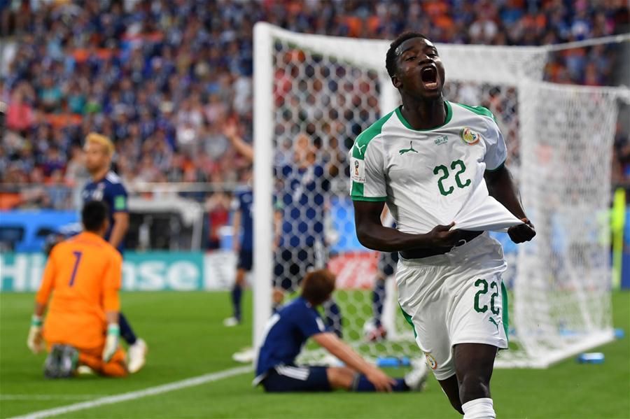 Moussa Wague (R front) of Senegal celebrates scoring during the 2018 FIFA World Cup Group H match between Japan and Senegal in Yekaterinburg, Russia, June 24, 2018. (Xinhua/Chen Cheng)

Most unlucky

Senegal can consider themselves desperately unfortunate not to advance to the round of 16. The African team defeated Poland in their opening match and looked the better side for long periods in a 2-2 draw with Japan. They paid the price for not capitalizing on their early dominance against Colombia on Thursday, losing 1-0. Despite finishing level with Japan on points, goals for and goals conceded, the Lions of Teranga were eliminated for having picked up more yellow cards.