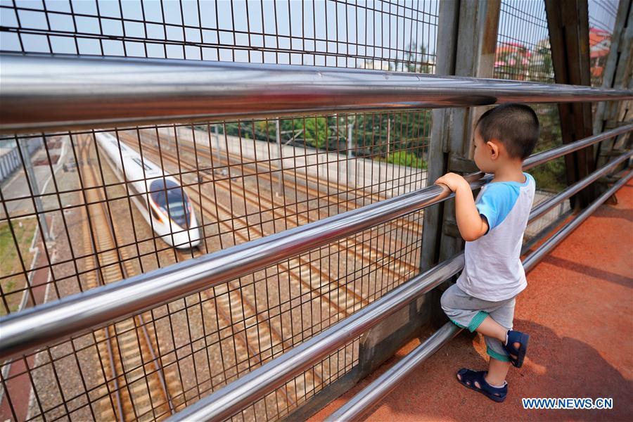 The G7 Fuxing bullet train departs the Beijing South Railway Station in Beijing, capital of China, July 1, 2018. The new longer Fuxing bullet train ran on the Beijing-Shanghai line for the first time on Sunday. With a designed speed of 350 kilometers per hour, the new train measures more than 400 meters in length and has 16 carriages, twice as many as current ones. It can carry nearly 1,200 passengers. (Xinhua/Xing Guangli)