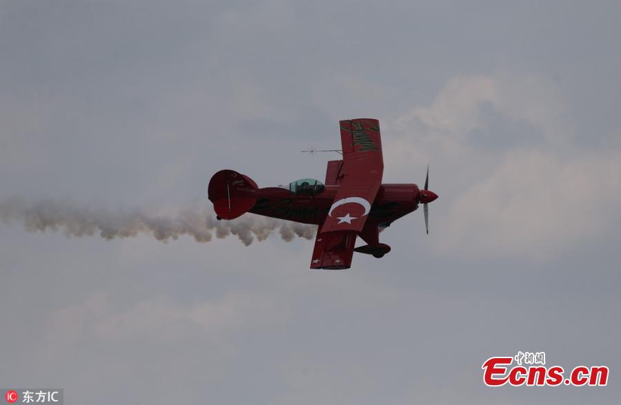 Semin Ozturk, Turkey\'s first professional female aerobatic pilot performs aerobatic flight within the World Pilots Day at the International Sportive Aviation Center, in Sivrihisar district of Eskisehir, Turkey, May 5, 2018. (Photo/IC)