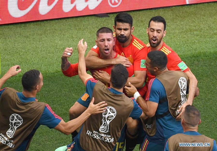 Players of Spain celebrate after Russia\'s Sergey Ignashevich scored an own goal during the 2018 FIFA World Cup round of 16 match between Spain and Russia in Moscow, Russia, July 1, 2018. (Xinhua/Wang Yuguo)