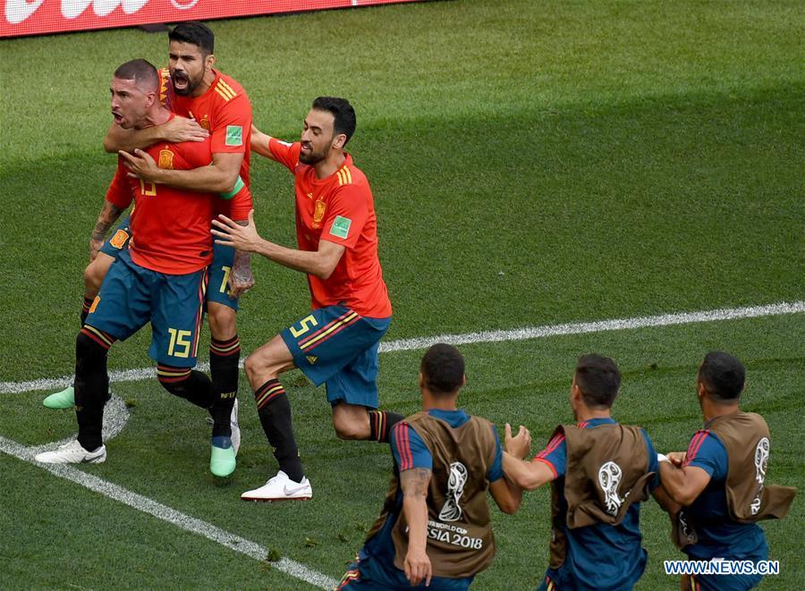 Players of Spain celebrate after Russia\'s Sergey Ignashevich scored an own goal during the 2018 FIFA World Cup round of 16 match between Spain and Russia in Moscow, Russia, July 1, 2018. (Xinhua/Wang Yuguo)