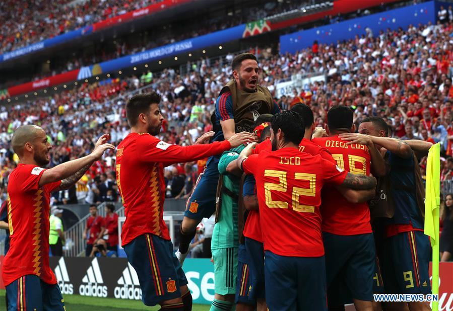 Players of Spain celebrate after Russia\'s Sergey Ignashevich scored an own goal during the 2018 FIFA World Cup round of 16 match between Spain and Russia in Moscow, Russia, July 1, 2018. (Xinhua/Cao Can)