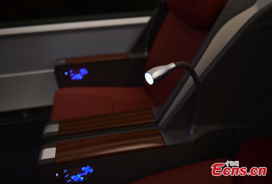 A view of the interior of the extended version of the Fuxing bullet train in Daxing District, Beijing. With a designed speed of 350 kilometers per hour, the new train is 414.26 meters long with 16 carriages, twice as many as the current Fuxing. It has 1,193 seats.  (Photo: China News Service/Zhai Lu)