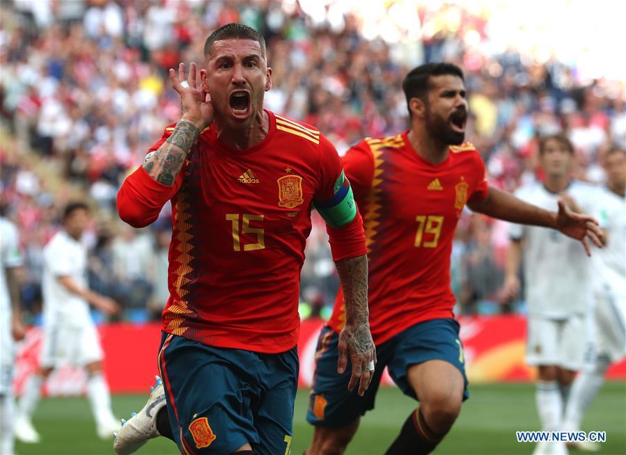 Sergio Ramos (L) of Spain celebrates after Russia\'s Sergey Ignashevich scored an own goal during the 2018 FIFA World Cup round of 16 match between Spain and Russia in Moscow, Russia, July 1, 2018. (Xinhua/Cao Can)