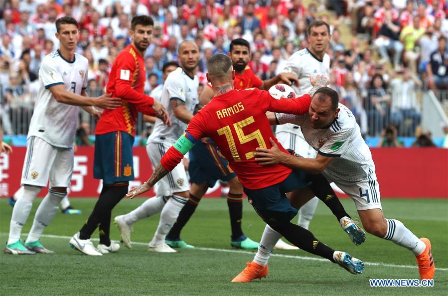 Sergey Ignashevich (R bottom) of Russia scores an own goal during the 2018 FIFA World Cup round of 16 match between Spain and Russia in Moscow, Russia, July 1, 2018. (Xinhua/Cao Can)