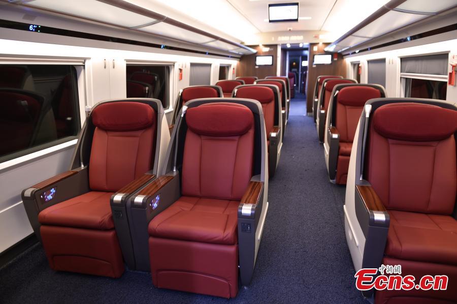 A view of the interior of the extended version of the Fuxing bullet train in Daxing District, Beijing. With a designed speed of 350 kilometers per hour, the new train is 414.26 meters long with 16 carriages, twice as many as the current Fuxing. It has 1,193 seats.  (Photo: China News Service/Zhai Lu)