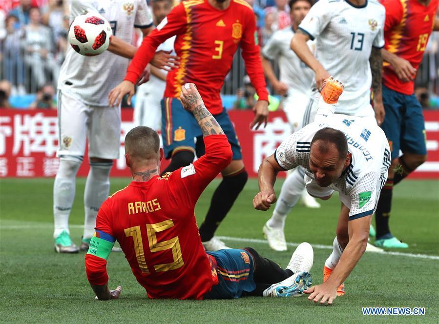 Sergey Ignashevich (R bottom) of Russia scores an own goal during the 2018 FIFA World Cup round of 16 match between Spain and Russia in Moscow, Russia, July 1, 2018. (Xinhua/Cao Can)