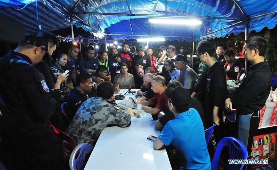 A rescuer briefs the press about the condition of the 12 teenagers and their football coach in Mae Sai, Chiang Rai province, northern Thailand, on July 2, 2018. Twelve teenagers and their football coach, trapped in a cave in northern Thailand for nine days, have been found alive on Monday night, Narongsak Osottanakorn, governor of Chiang Rai province said. (Xinhua/Rachen Sageamsak)