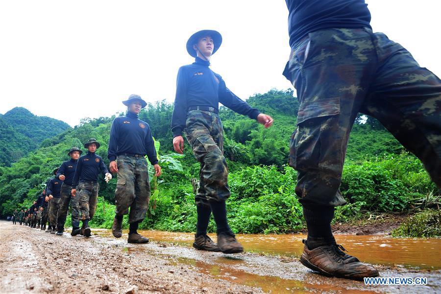Rescuers go to a cave complex where 12 teenagers and their football coach went missing in Mae Sai, Chiang Rai province, in northern Thailand, July 2, 2018. Twelve teenagers and their football coach, trapped in a cave in northern Thailand for nine days, have been found alive on Monday night, Narongsak Osottanakorn, governor of Chiang Rai province said. (Xinhua/Rachen Sageamsak)