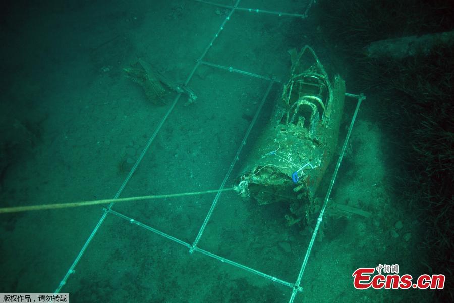 Plastic frames are laid by divers from the FS Pluton M622 navy de-mining ship, swims on July 2, 2018, around the wreck of an USAAF P-47 Thunderbolt (Warthog) US fighter plane, which crashed in 1944 during the Second World War (WWII), off the French Mediterranean island of Corsica, where a unite was based from 1944 at what was then dubbed the \'Alto airfield\' on the east coast of the island. - The US agency the Defense POW/MIA Accounting Agency (DPAA) along with the help of the French navy are using divers to search for any remains of the US pilots that died during WWII and to identify them using their DNA, also collecting any other relevant material. (Photo/Agencies)