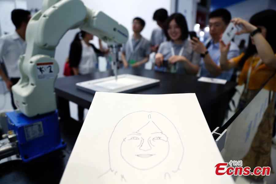 Robots on display at the CIROS2018 (China International Robot Show) in Shanghai, July 4, 2018. More than 500 companies from 13 countries and regions showcased various robot products and services. (Photo: China News Service/Tang Yanjun)