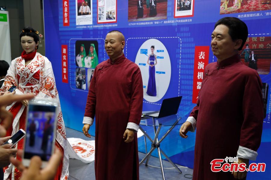 Robots on display at the CIROS2018 (China International Robot Show) in Shanghai, July 4, 2018. More than 500 companies from 13 countries and regions showcased various robot products and services. (Photo: China News Service/Tang Yanjun)
