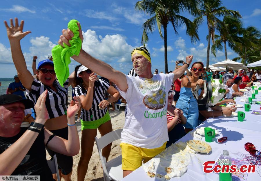 Photo taken on July 4, 2018 shows Trey Bergman, a lawyer of Houston, won Key West\'s annual Key lime pie eating contest for the second year in a row, scarfing down the signature Florida dessert in less than two minutes. Without using his hands, Trey Bergman defeated 24 other contenders for the title. Clad in protective googles and a \